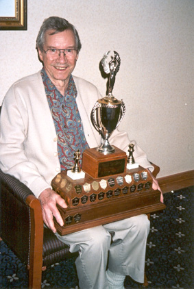 Miervaldis Jursevskis holding the current B.C. Championship Trophy